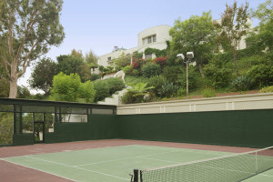 A tennis court seen in the backyard of the property. Photo courtesy of Caldwell Banker. 