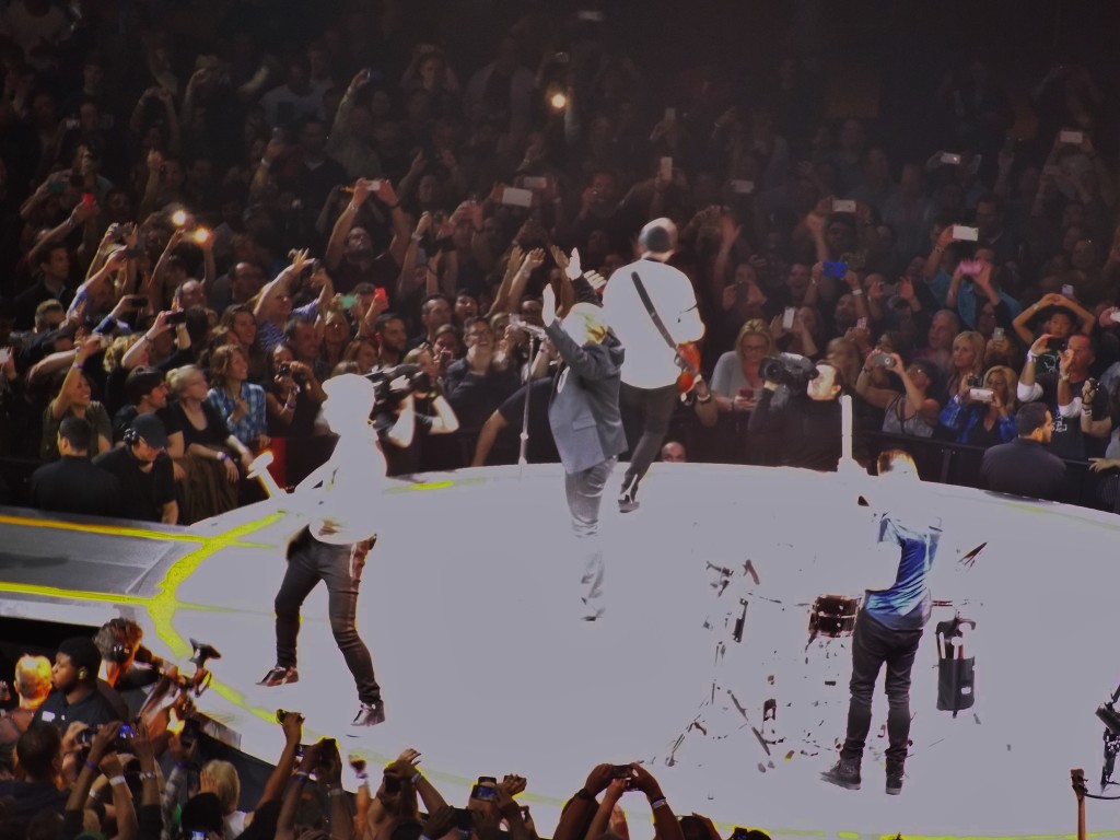 The crowd goes wild as U2 interacts in a very intimate way, only inches from the adoring throngs. Photo by Michael C. Floch.