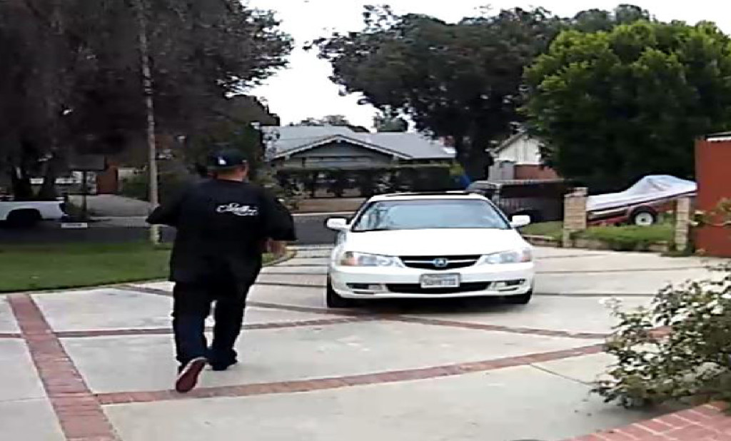 Image of one of the suspects and the vehicle that has been spotted stealing packages. Photo courtesy of the LAPD.