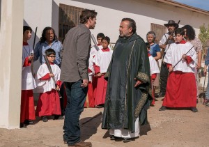 Thomas Abigail (Dougray Scott) confronts the parishioners outside of the church.