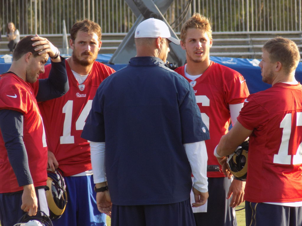 The Quarterbacks talk to the coach, including starter Case Keenum and Number one overall pick Jared Goff at the final day of the Los Angeles Rams Camp in Irvine, Ca. (Photo: Michael C. FLoch)