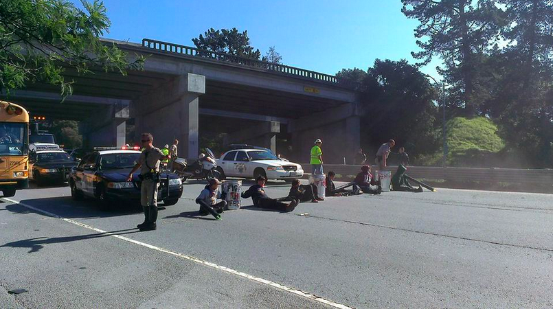 Student protesters block Highway 1 in a display of civil disobedience.