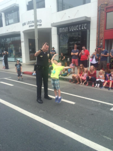 High five! Local enforcement interact with the public. Photo Courtesy Nikki Dibbling @ikkinesque