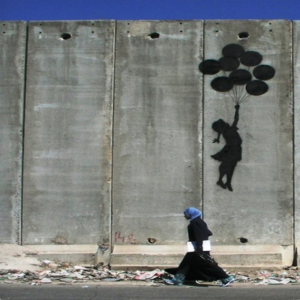 "Balloon Debate" by Banksy on Palestinian Wall