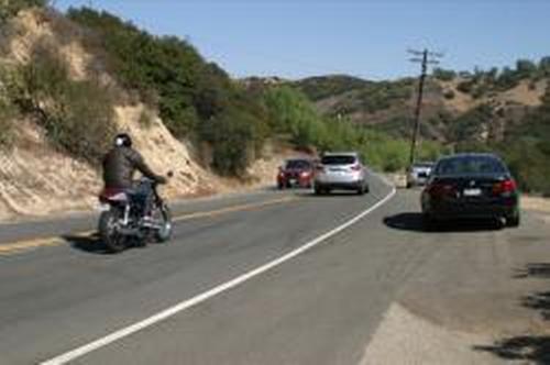 Collision on Pacific Coast Highway between a motorcycle and car causes one critical injury.