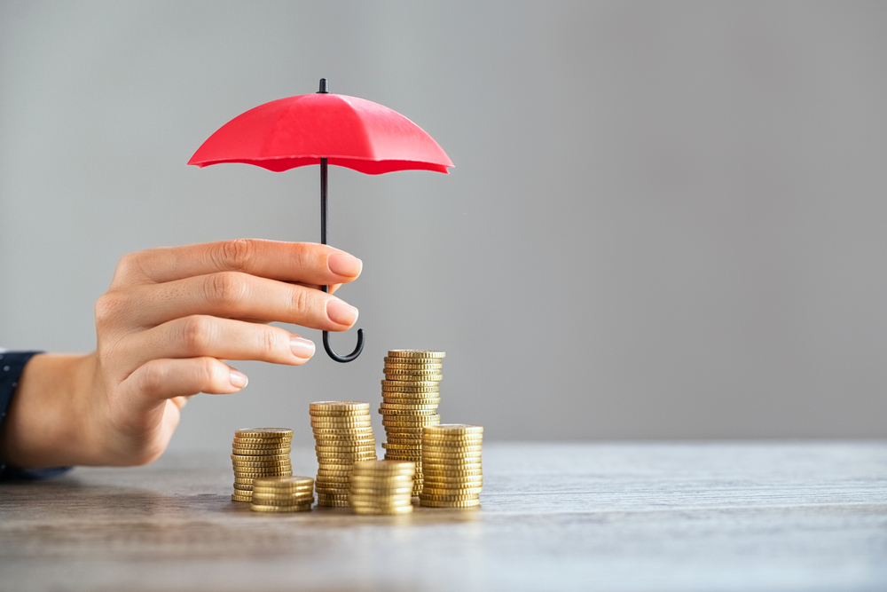 Young,Woman,Hand,Holding,Small,Red,Umbrella,Over,Pile,Of