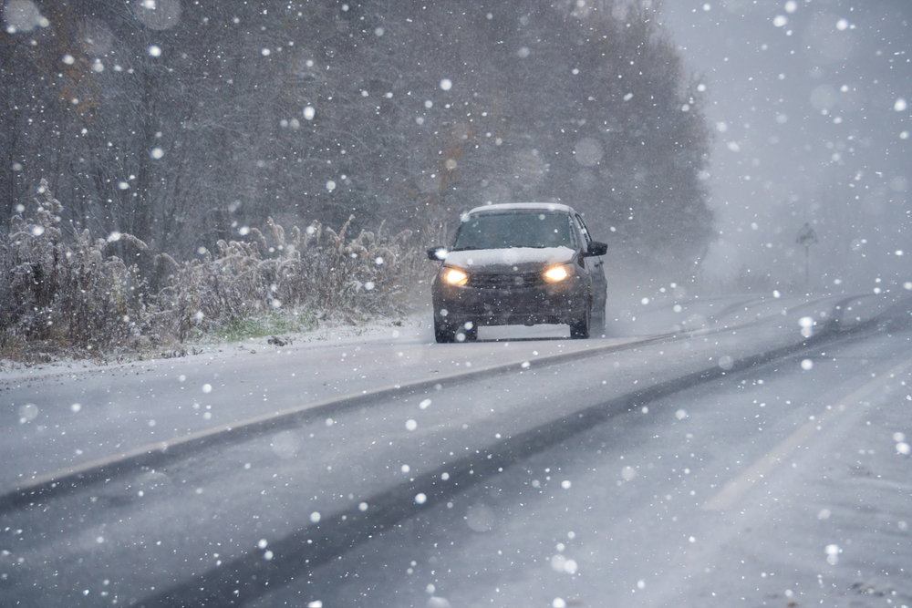 Car,Is,Driving,On,A,Winter,Road,In,A,Blizzard